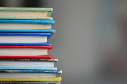 shallow focus photography of books; Vinod Gupta education India