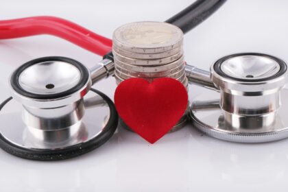 a stethoscope with a red heart on top of it; long-term care insurance