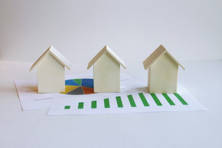 three small houses sitting on top of a piece of paper; home sale capital gains exclusion